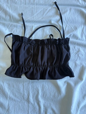 Black crop top like new with adjustable fabric and cross back