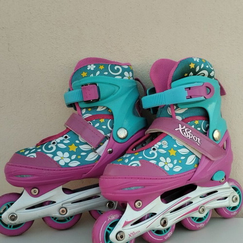 Xspot adjustable rollers size 35/37 used, turquoise pink with flowers