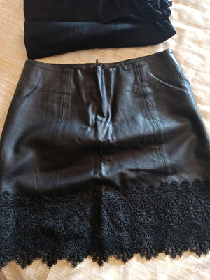 Leather skirt like new with embossed lace, mini length, black