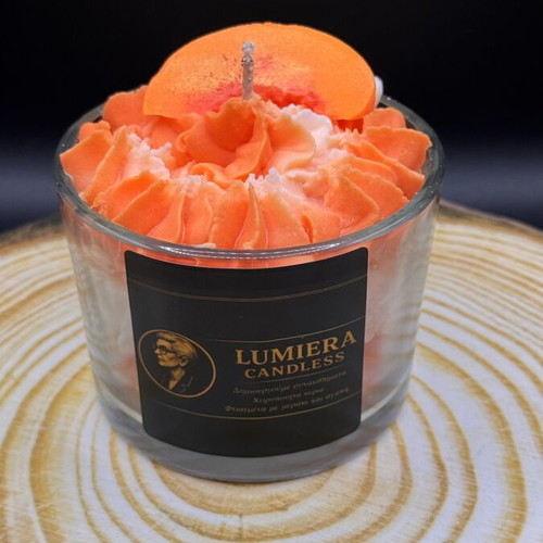 Handmade soy candle in glass container with peach scent