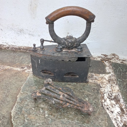 Karavaki Charcoal Iron used with ornate handle design