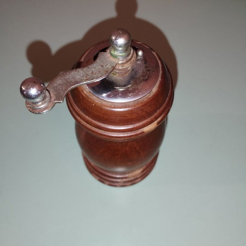 Vintage wooden spice grinder used
