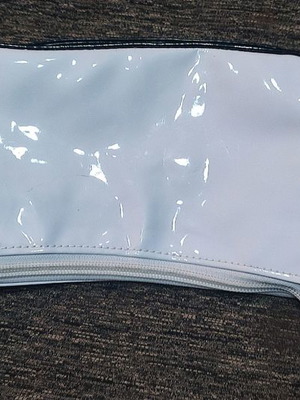 Handbag new with glossy texture and patterns