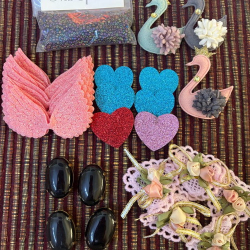 Decorative ribbons, cords, lace and craft elements like new