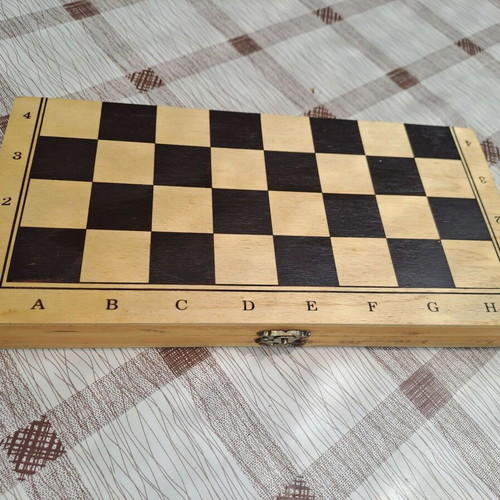 Wooden backgammon medium size used with pieces and dice