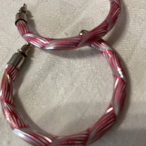 Hoop earrings like new with pink and silver embossed design
