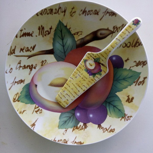 Ceramic serving platter with matching spatula, fruit design