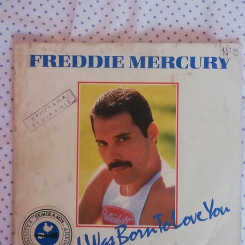 45 RPM vinyl record used with minor cover wear