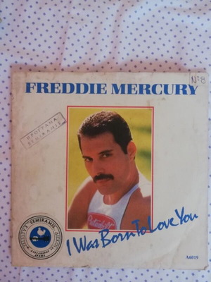 45 RPM vinyl record used with minor cover wear