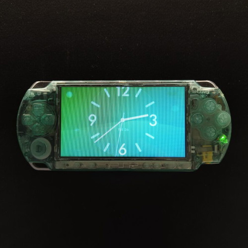 PlayStation Portable 2000 прозрачен зелен ремонтиран с 64GB microSD и игри