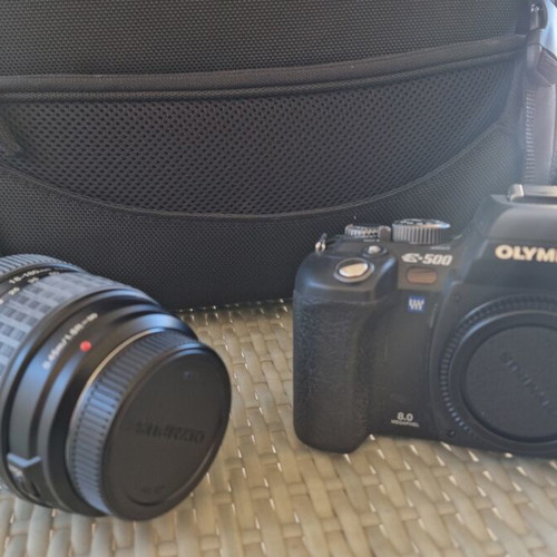 Olympus E-500 DSLR camera used with telephoto lens and case