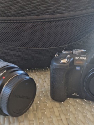 Olympus E-500 DSLR camera used with telephoto lens and case