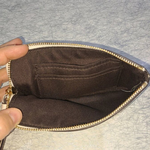 Coach wristlet bag used, beige with strap