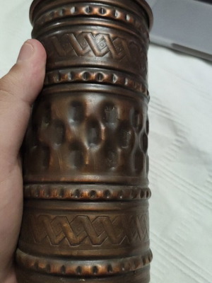Vintage hammered copper vase used with embossed geometric patterns