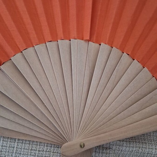 Fan refurbished with wooden base and orange fabric