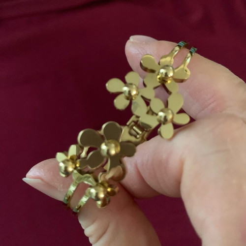 Bracelet in gold color with carved flowers like new