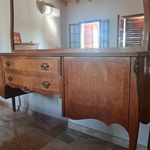 Classic wooden buffet with large curved mirror