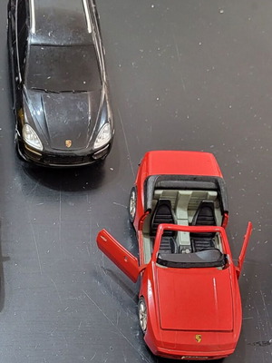 Set of 2 used Ferrari and Porsche toy cars