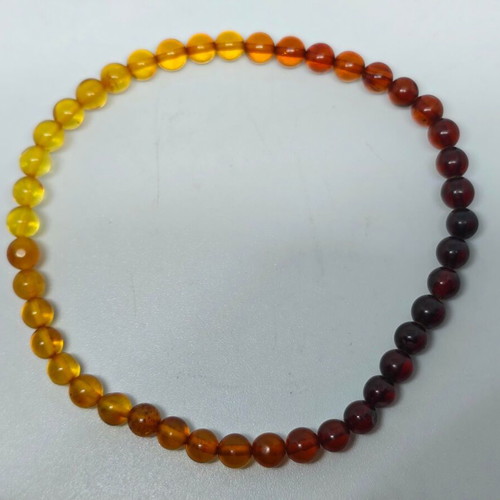 Handmade bracelet from natural amber with color gradient like new