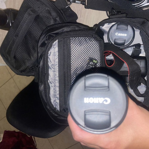 Canon EOS 1200D camera kit with lenses, memory card, battery, charger, and carrying bag