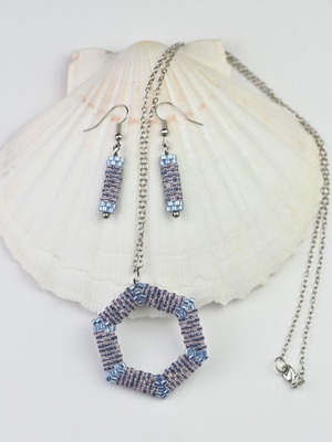 Custom-made jewelry set in light blue tones with hexagonal pendant