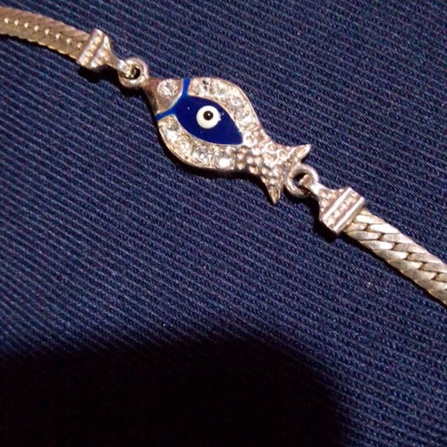Silver 925 bracelet like new with blue eye and stones