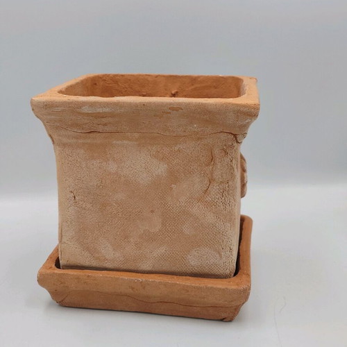 Square ceramic pot new from high-quality clay with saucer