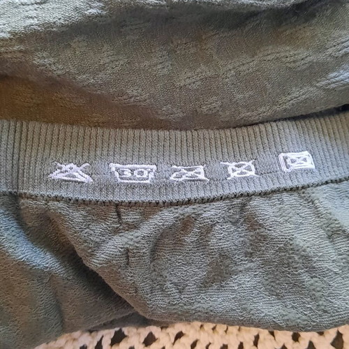Niederberger Midi skirt new, khaki with embossed texture and knitted motif