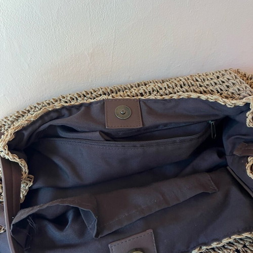 Woven boho style beach bag like new with brown leather handles and inner zip pocket