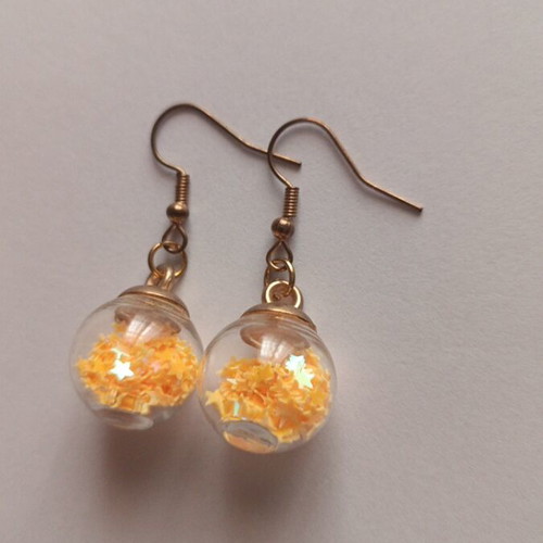 Earrings balls with orange stars new, gold-colored