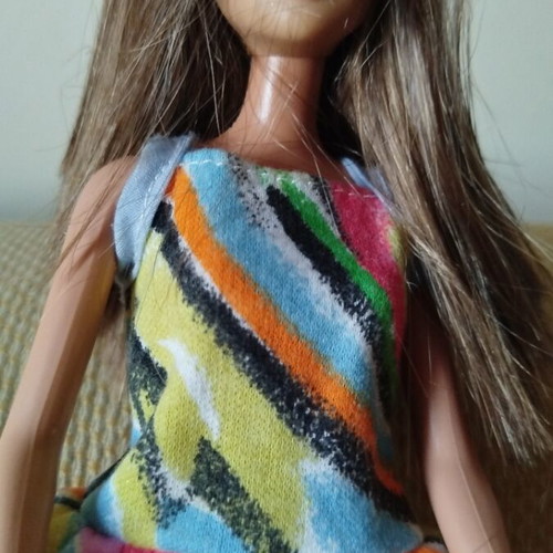 Barbie Fashionistas doll like new with colorful geometric dress and orange boots