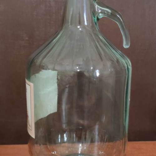Vintage glass demijohn 5L with handle and original label used