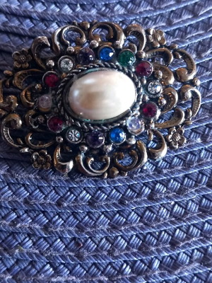 Bronze brooch with pearl and multicolored rhinestones