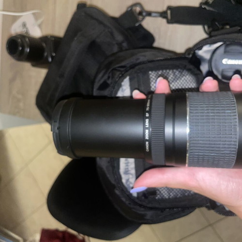 Canon EOS 1200D camera kit with lenses, memory card, battery, charger, and carrying bag