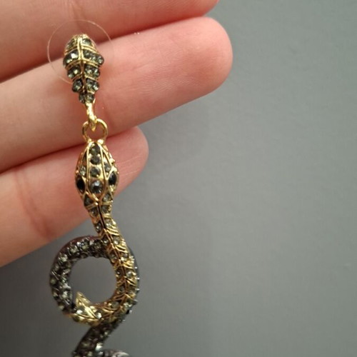 Snake earrings new with black and gold stones