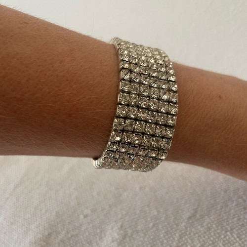 Bracelet with Crystals like new, silver color, elastic and sparkling