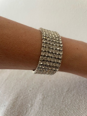 Bracelet with Crystals like new, silver color, elastic and sparkling