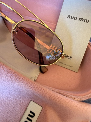 Miu Miu SMU 54ZS ZVN-70D sunglasses like new, gold frame, pink lenses