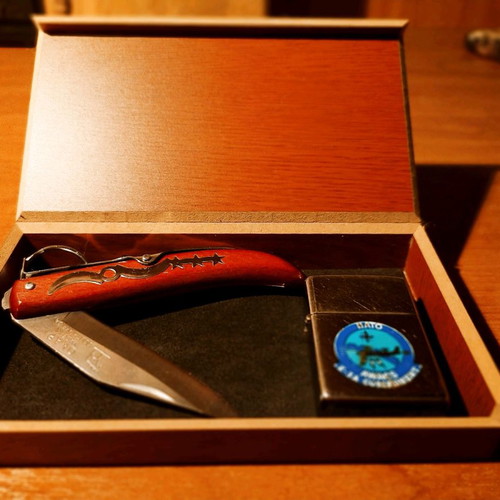 Collectible Zippo lighter 32 years old and handmade Okapi knife.