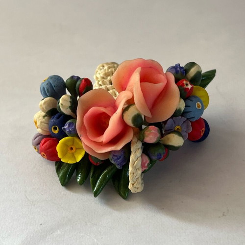Vintage flower brooch with woven basket and plastic flowers like new