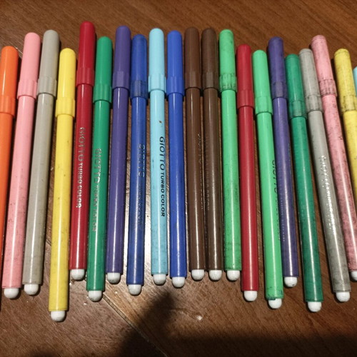 Various school supplies used with Giotto markers and pencil cases