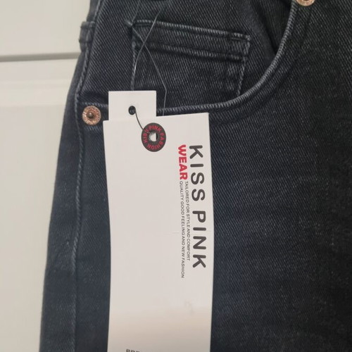 Jean with crooked button fastening black size small, new with tags