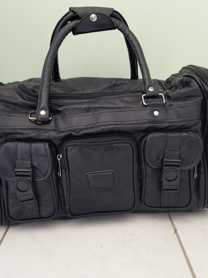 Travel bag like new, black, synthetic leather with extra strap