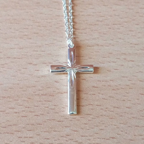 Steel cross like new, silver color