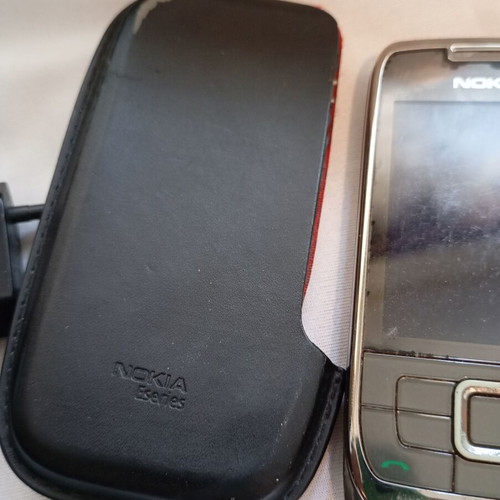 Nokia E66 retro slider phone used with original accessories