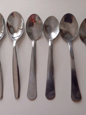 Tea spoons set of 8 like new, different designs