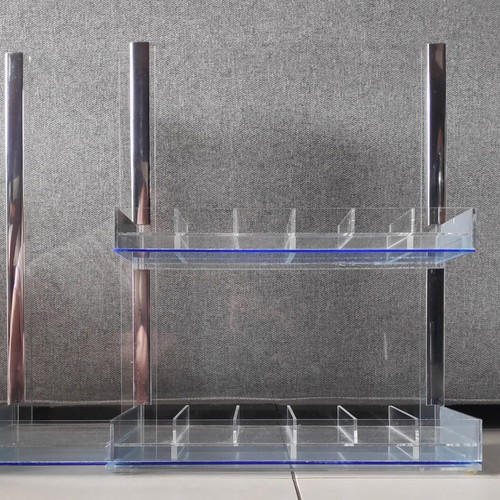 Tabletop plexiglass product display stand like new with metal decorations