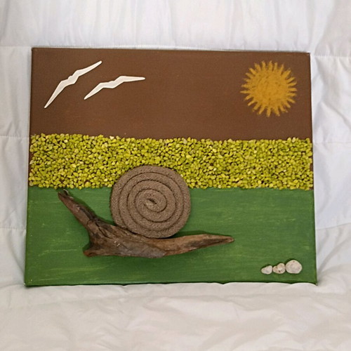 Handmade canvas art with snail and decorative stones