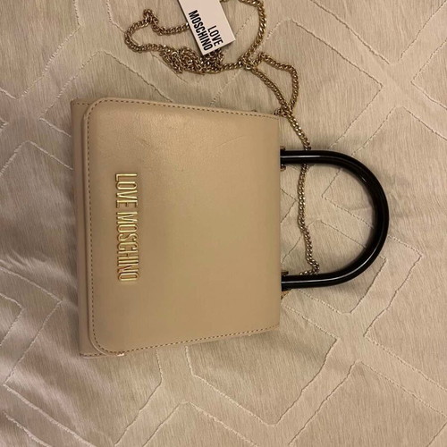 Love Moschino clutch handbag used, beige with black handle