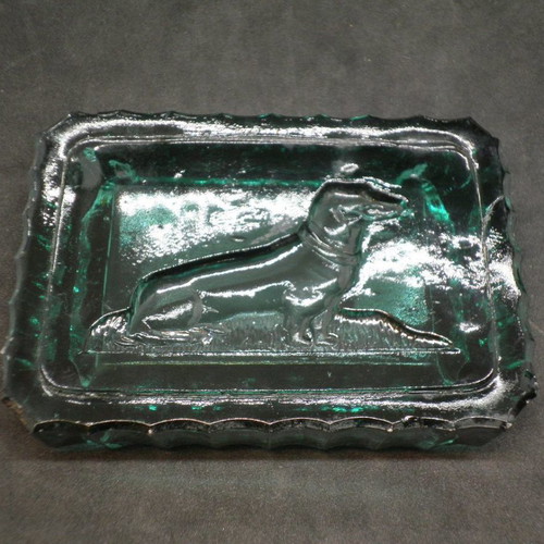 Antique ashtrays pair used with embossed dogs in dark green glass